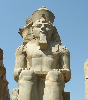 Statue of Pharaoh Ramesses II standing at the Luxor Temple