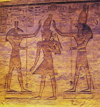 Ancient carving of gods Seth and Horus surrounding the pharaoh